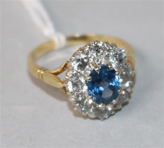 A 1970s 18ct gold, sapphire and diamond oval cluster ring, size P.